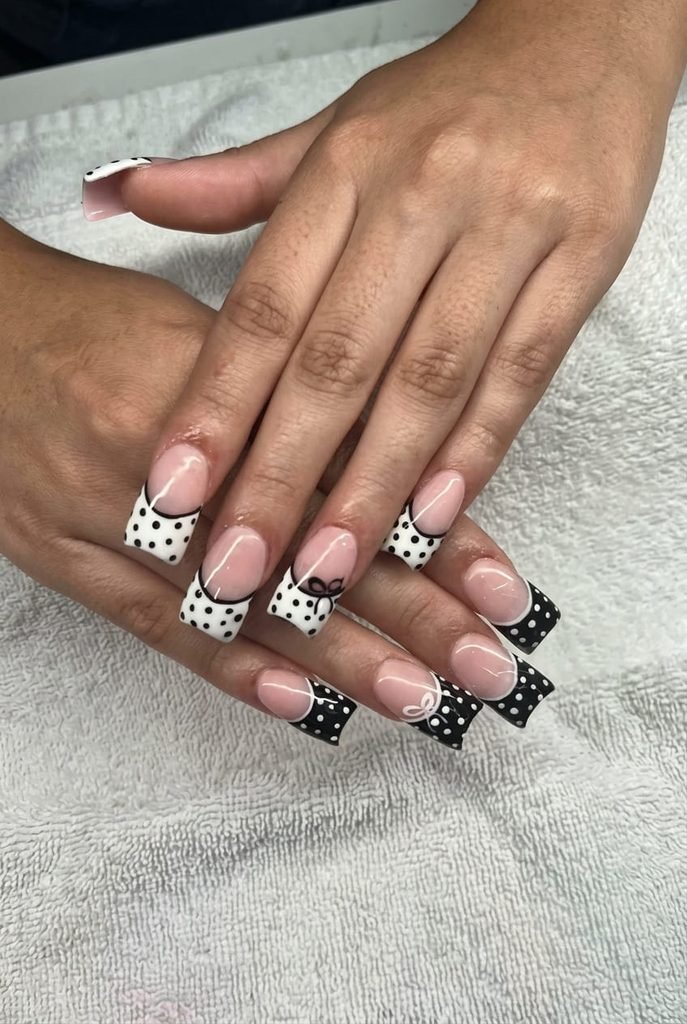 cute back to school nails with white polka dot design
